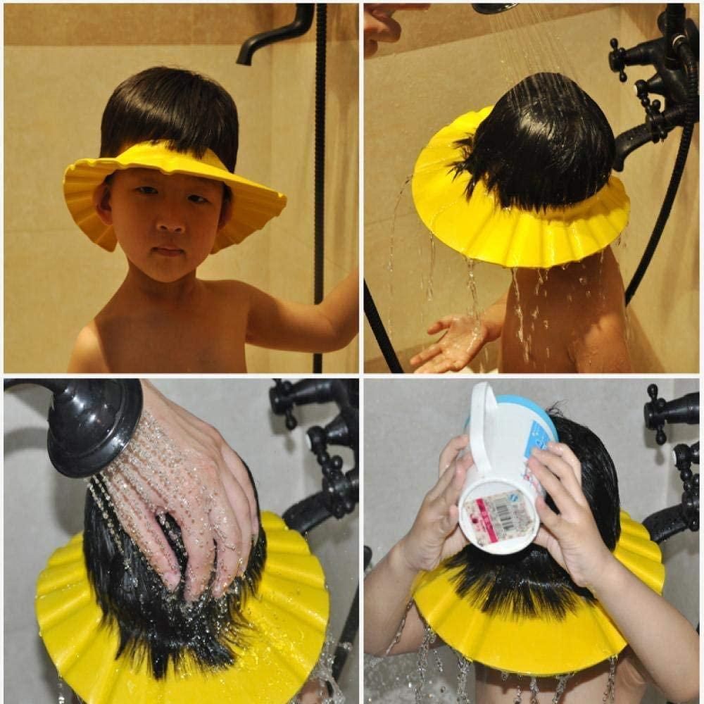 Child using a yellow shower cap to wash hair in a bathroom setting.