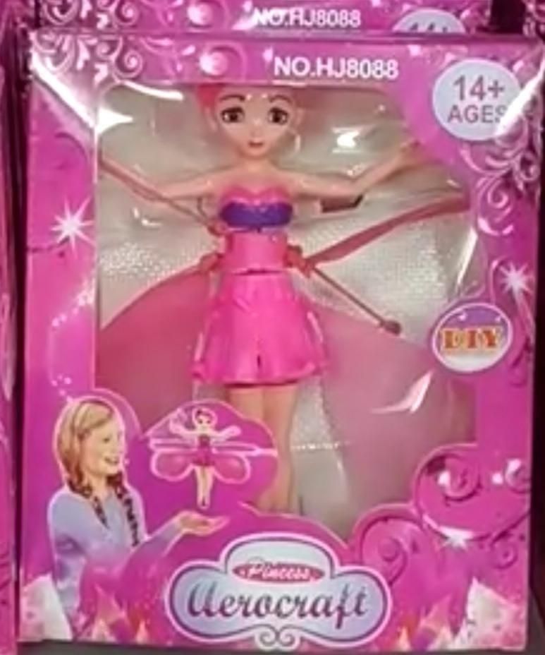 Toy figure in pink dress with 'Aerocraft' branding on a pink packaging background