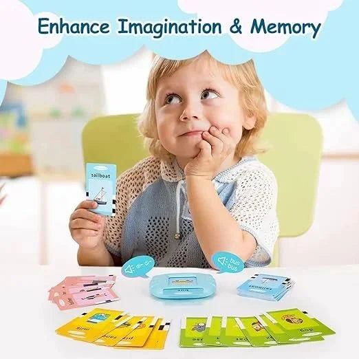 Child playing with educational cards, sitting at a table with cards spread out.