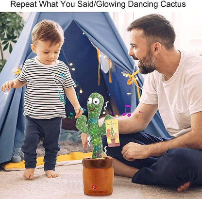 Man and child playing with a glowing dancing cactus toy in front of a blue tent.