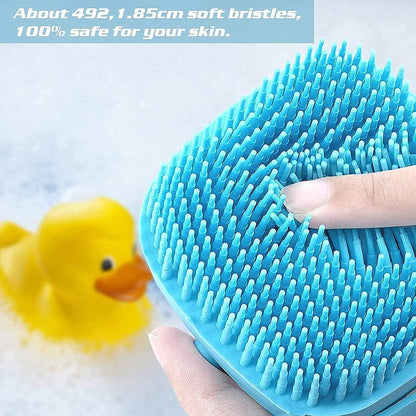 Blue silicone scrubber with soft bristles held by a hand, next to a yellow rubber duck.