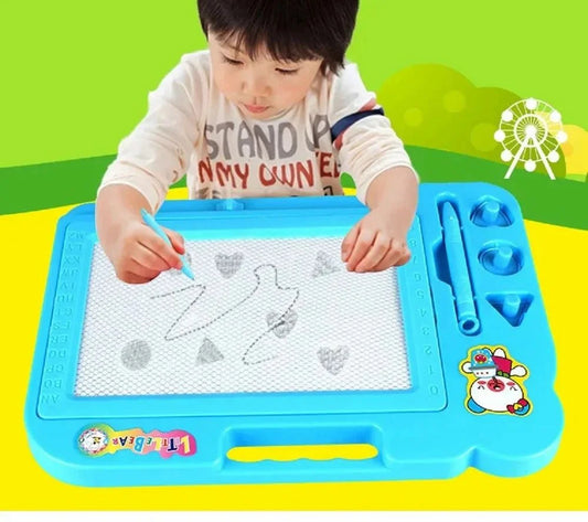 Child drawing on a blue and green toy board with a pen.