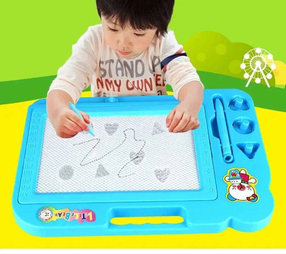 Child drawing on a blue and green toy board with a pen.