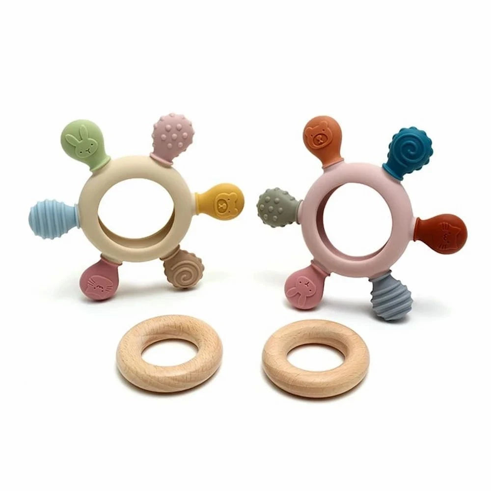 Two colorful baby teething rings with wooden alternatives on a white background